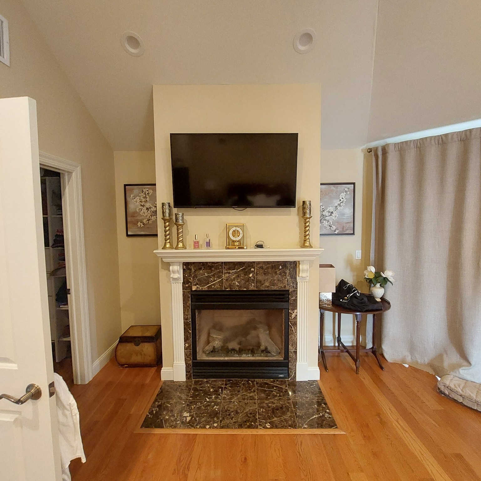 Fireplace and TV wall before renovation
